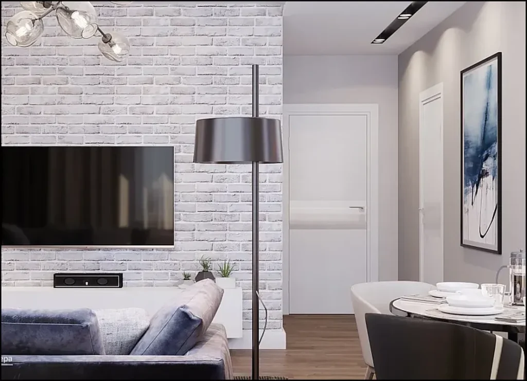 Декоративный кирпич в гостиной с нейтральной мебелью