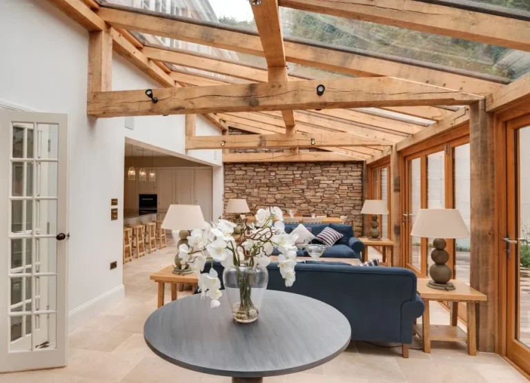 Modern room with architectural ceiling beam elements.