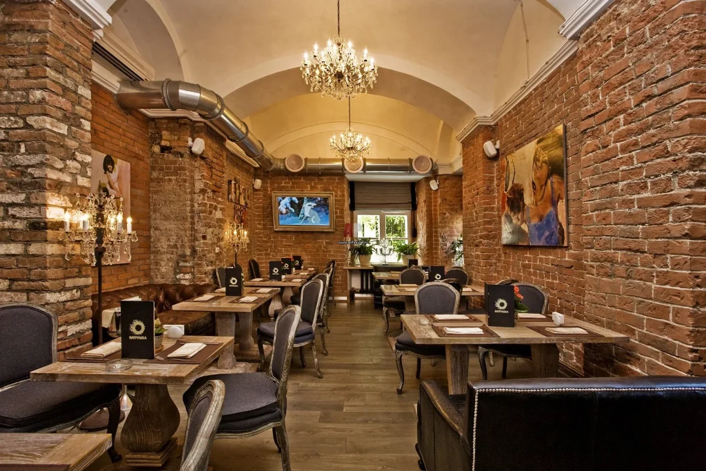Modern café interior with exposed ceiling features.