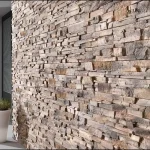 Hallway featuring decorative stone wall cladding.