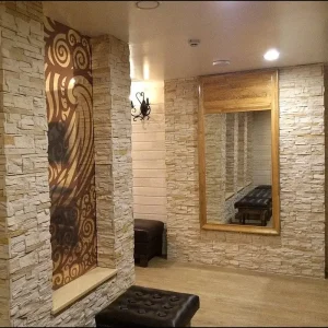 Elegant hallway with natural-looking decorative stone wall.