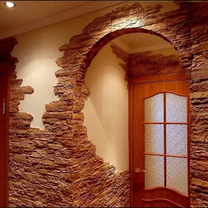 Elegant corridor with decorative stone wall finish.