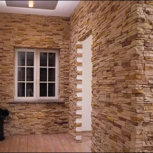 Interior corridor decorated with textured stone panels.