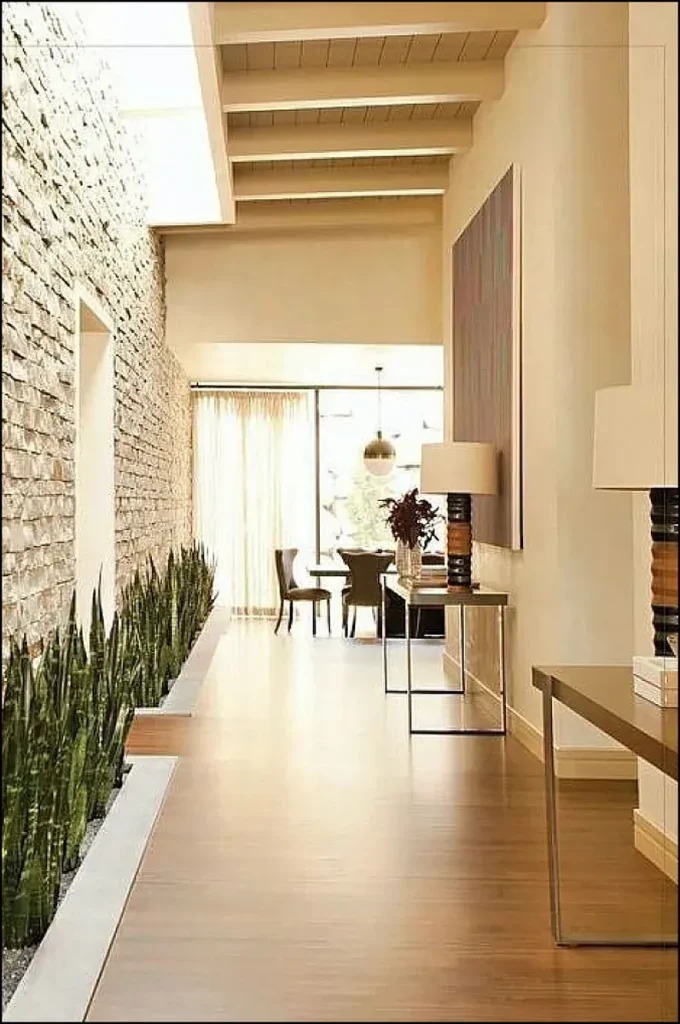Decorative stone wall adding texture to a hallway.