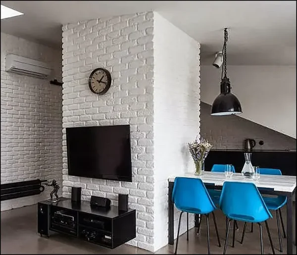 Minimalist bedroom featuring gypsum brick accent wall.