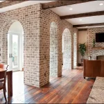 Bright interior with textured gypsum brick wall cladding.