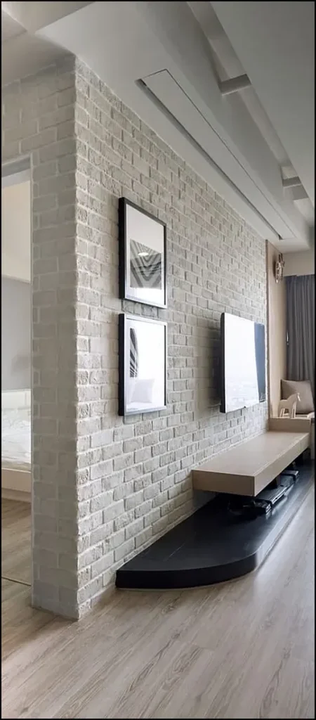 Contemporary living room featuring gypsum brick wall cladding.