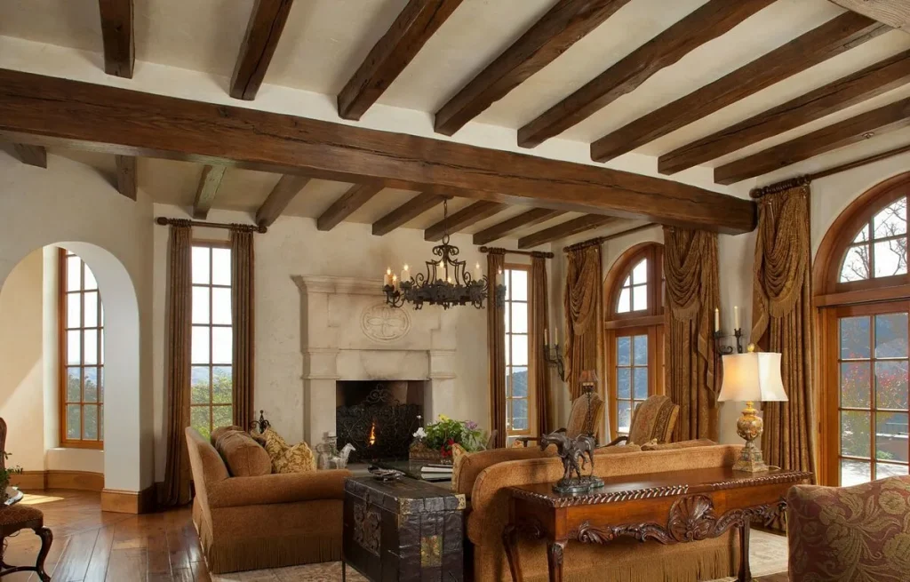 Industrial living room with exposed steel support beams along the wall and ceiling.