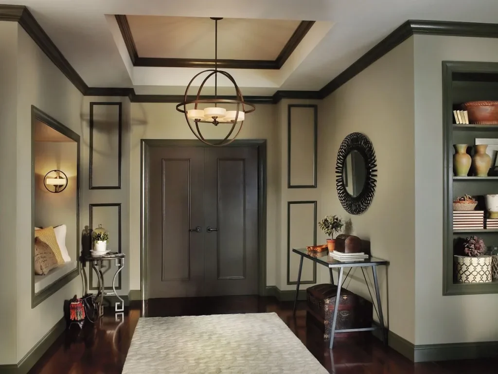 Modern apartment room with black-painted ceiling beams and recessed lighting.