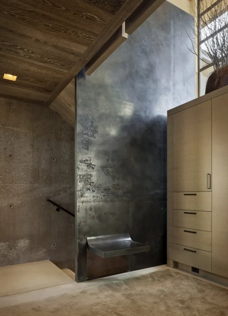 Contemporary living room featuring a concrete-effect wall.