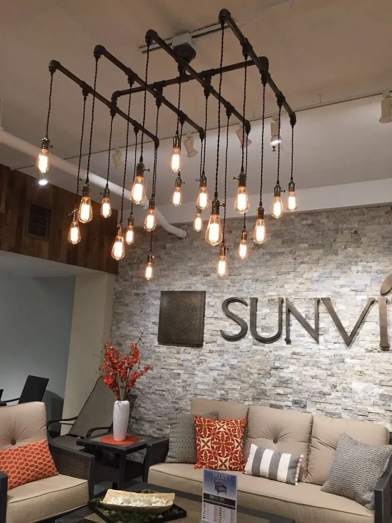 Modern room design with a black metal cage pendant fixture.