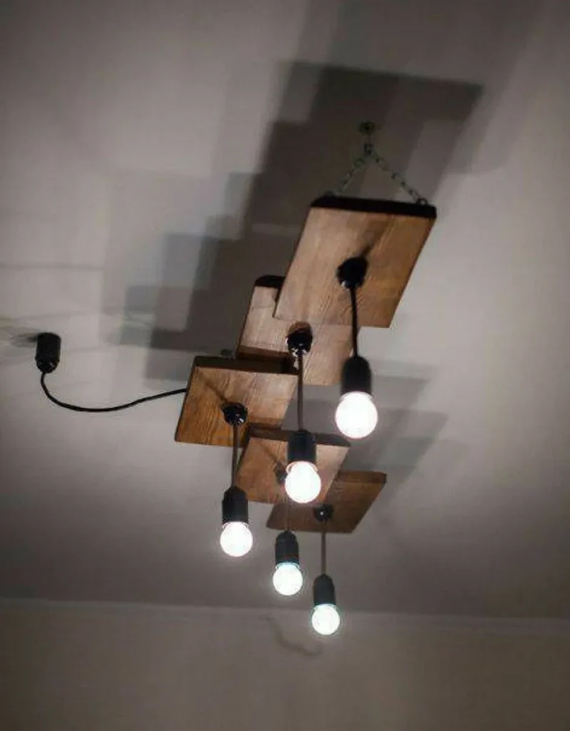 Concrete ceiling with surface-mounted industrial directional lights.