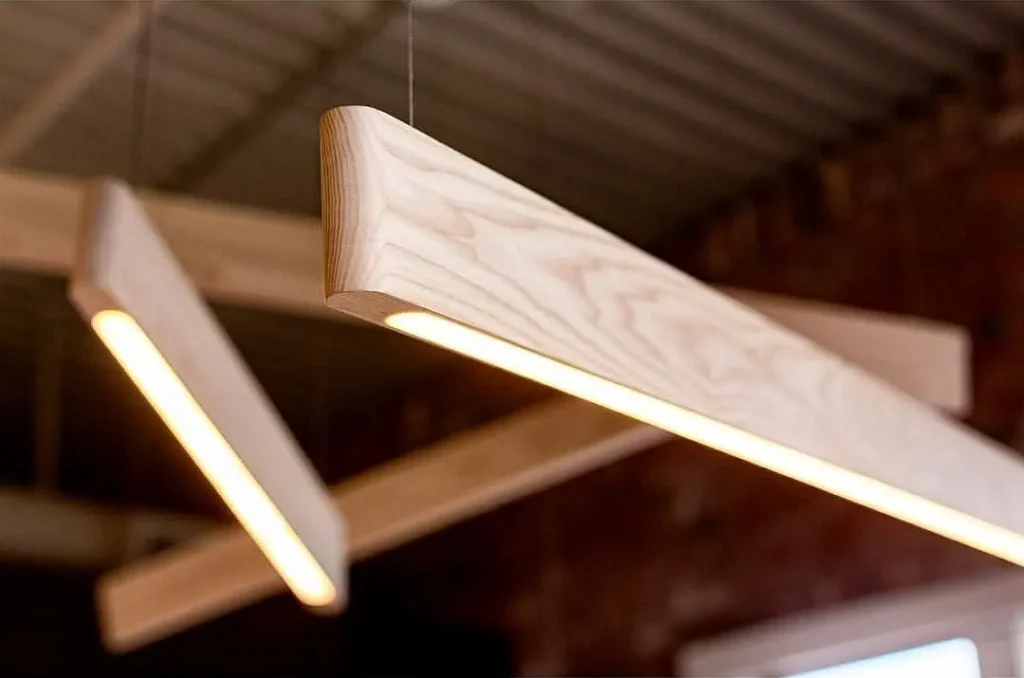 Loft-style living room with a tripod floor lamp.
