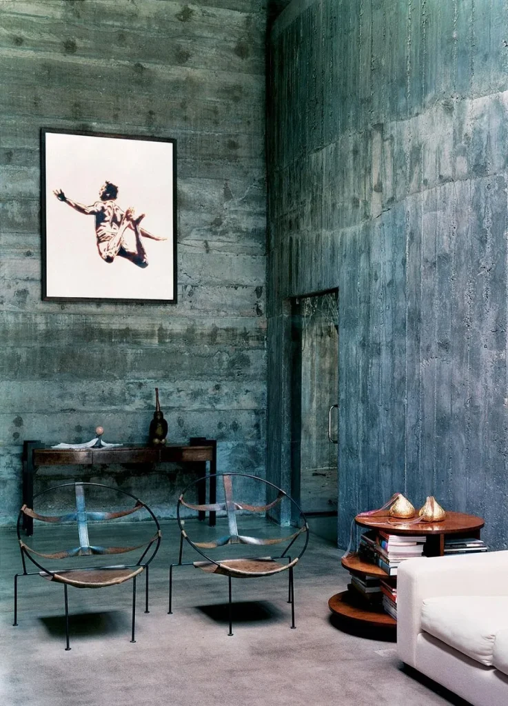 Minimalist interior layout featuring clean-lined concrete wall finishes.