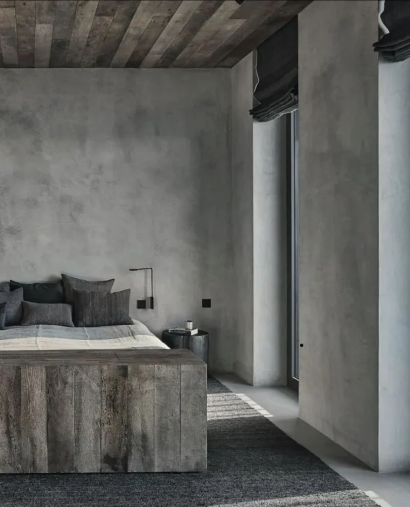 Living room TV wall featuring dark grey decorative concrete paneling.