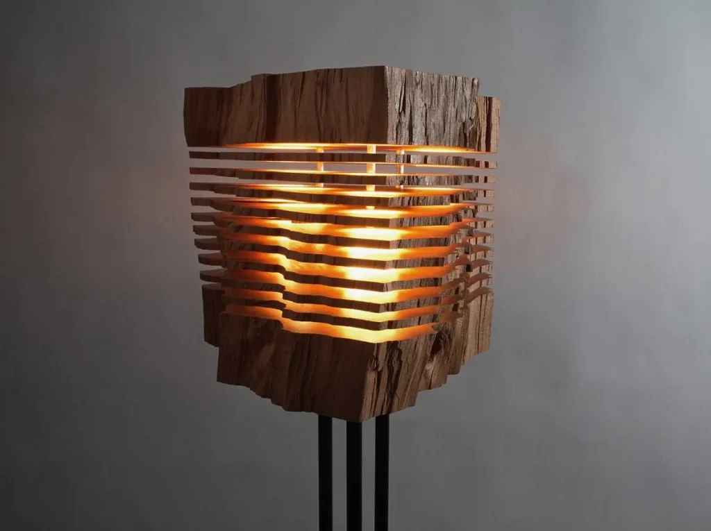 Wall-mounted metal pipe light fixture with vintage Edison bulbs.
