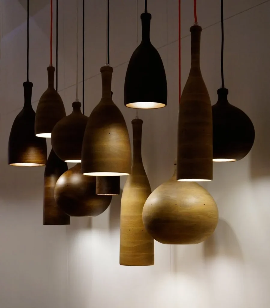 Brass finish industrial pendant lamp with a clear glass shade.
