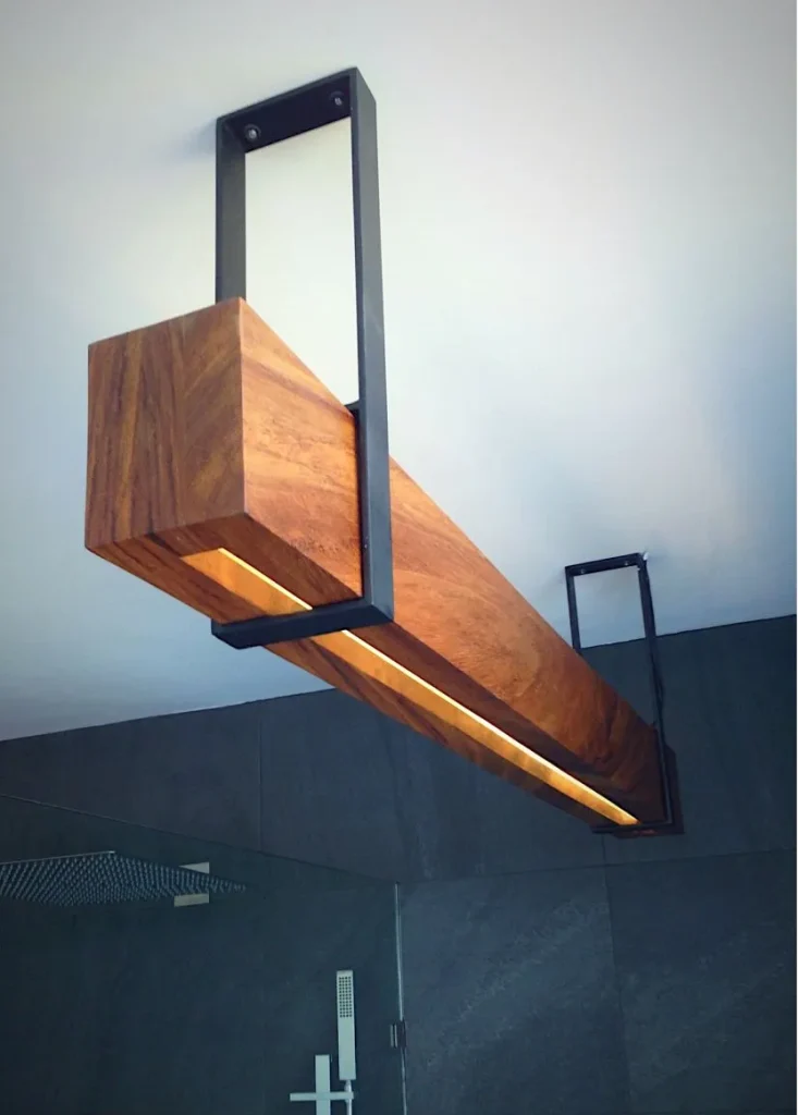 Industrial ceiling light fixture with an adjustable metal arm.