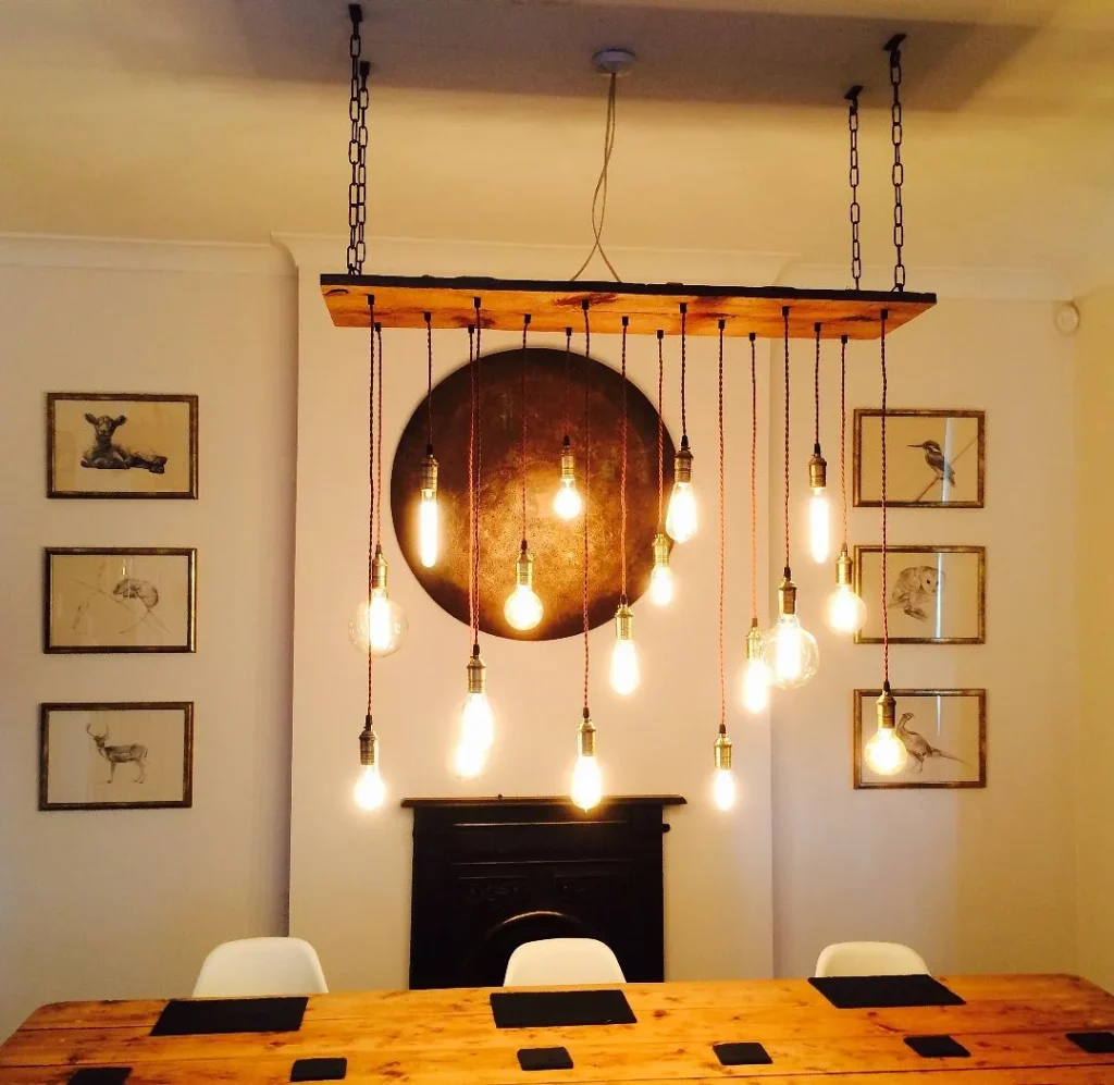 Rectangular metal frame island pendant light fixture.