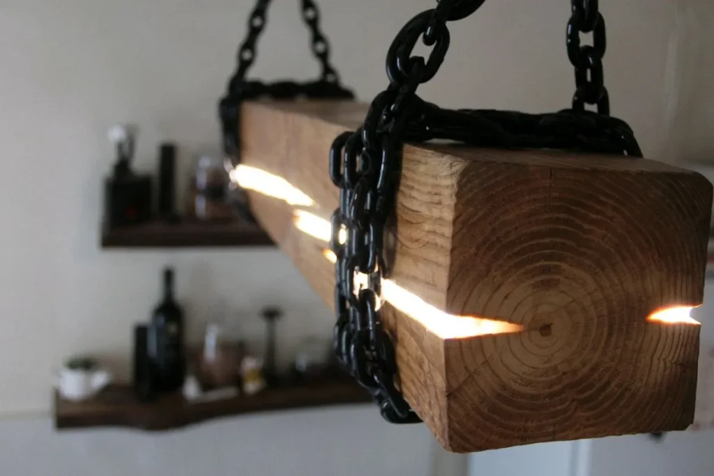 Black metal industrial pendant light fixture with an open shade.
