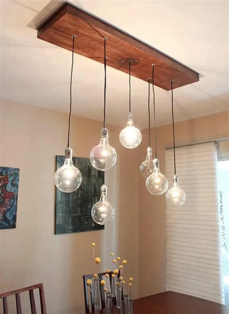 Wall-mounted metal spotlight lamp on a swivel bracket.