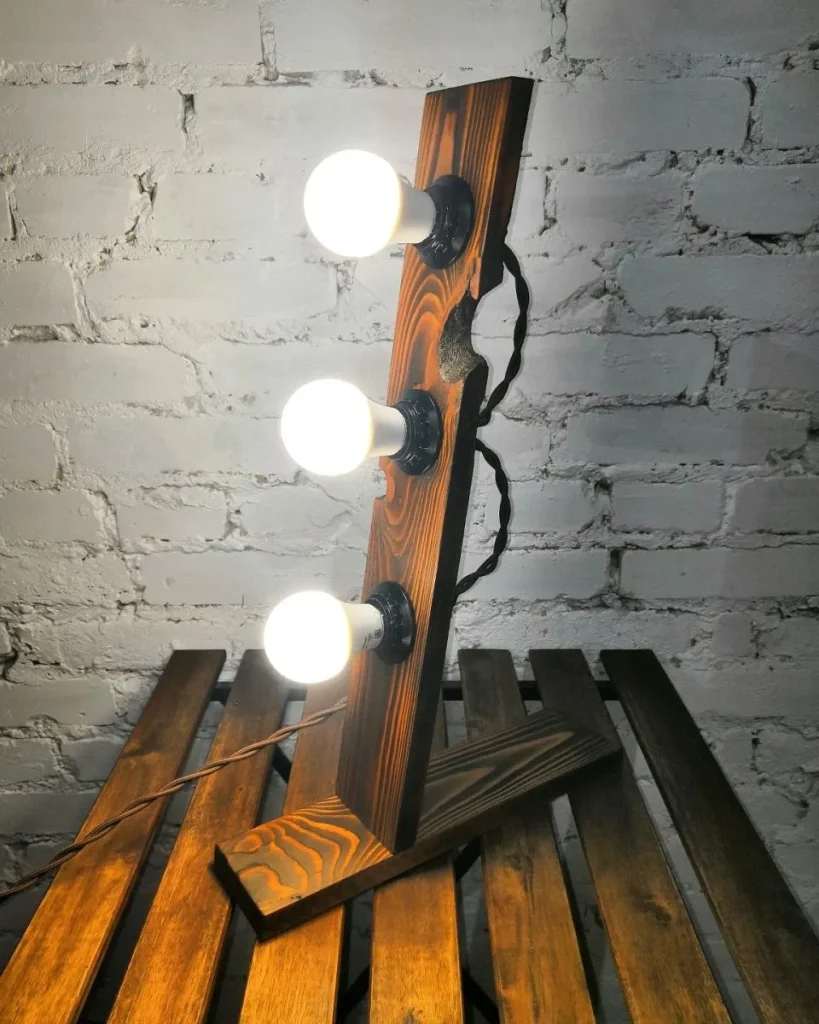 Hanging industrial light fixture with a wire mesh shade.