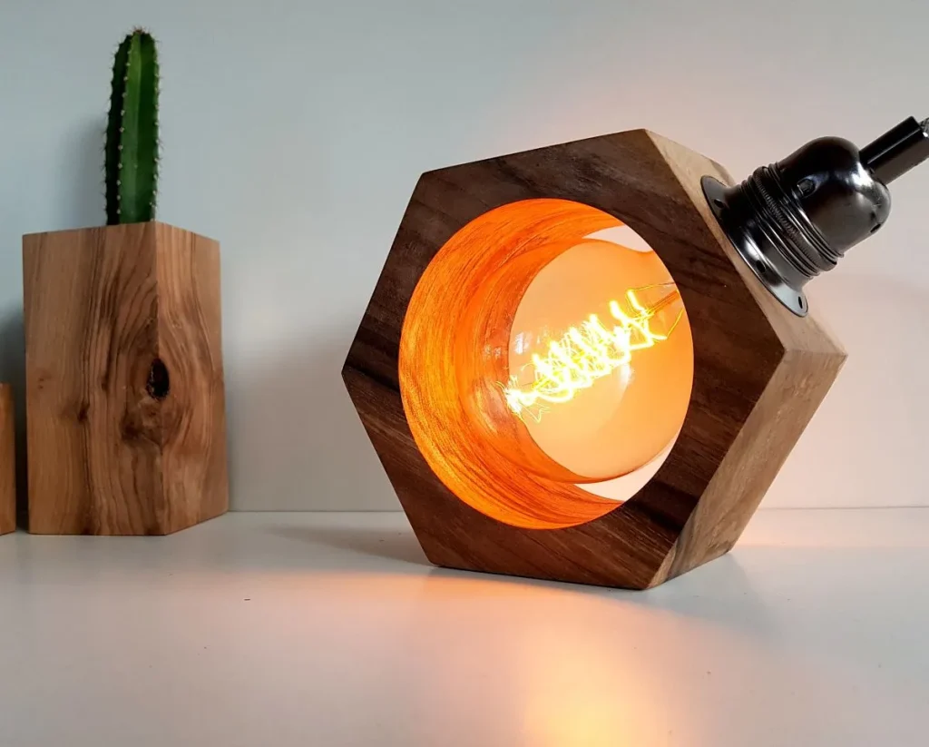 Minimalist exposed Edison bulb hanging from a dark cord.