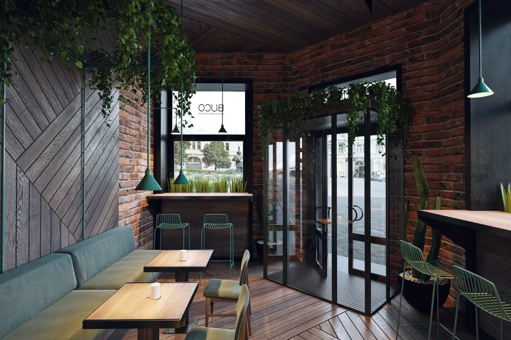 Spacious cafe layout with concrete walls and dark leather seating.