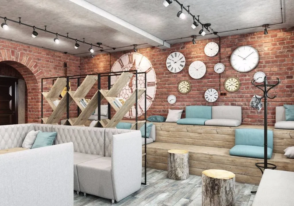 Cafe bar area with hanging Edison bulb lights and a brick backdrop.