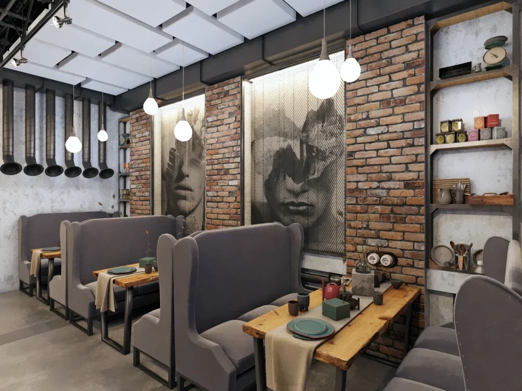 Industrial coffee shop counter with black metal finishes and warm illumination.