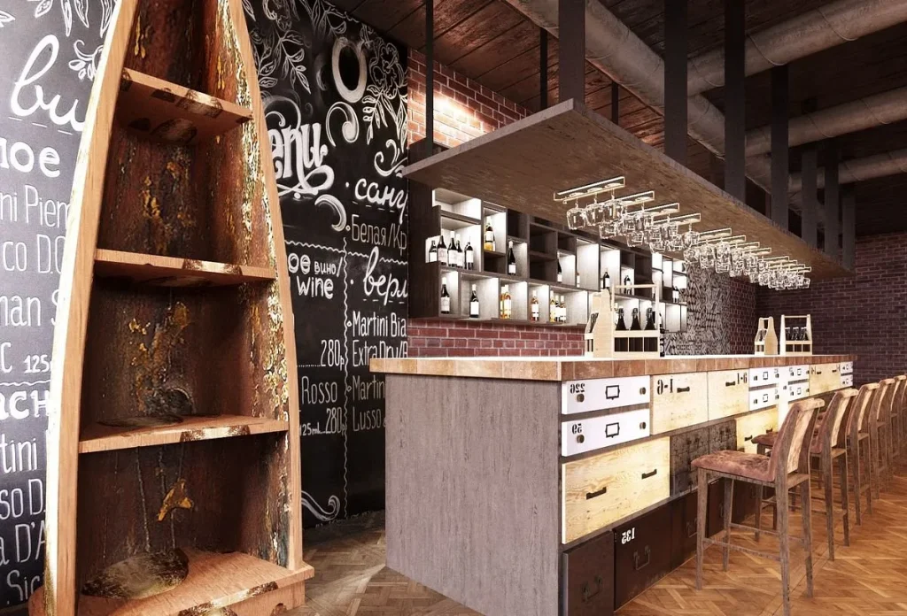 Loft-style cafe seating area set against a textured grey concrete wall.