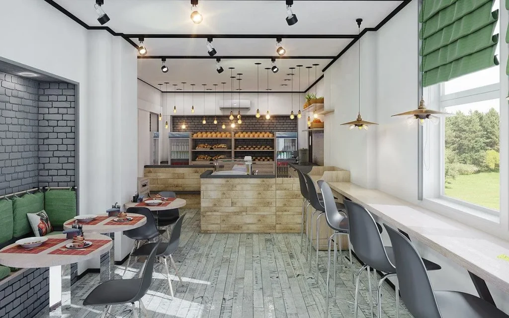 Cafe interior design with exposed metal piping and Edison bulb chandeliers.