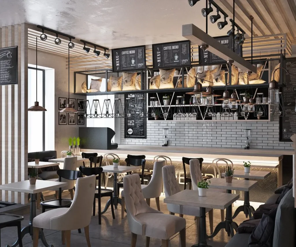 Industrial style cafe interior with track lighting and open pipework.