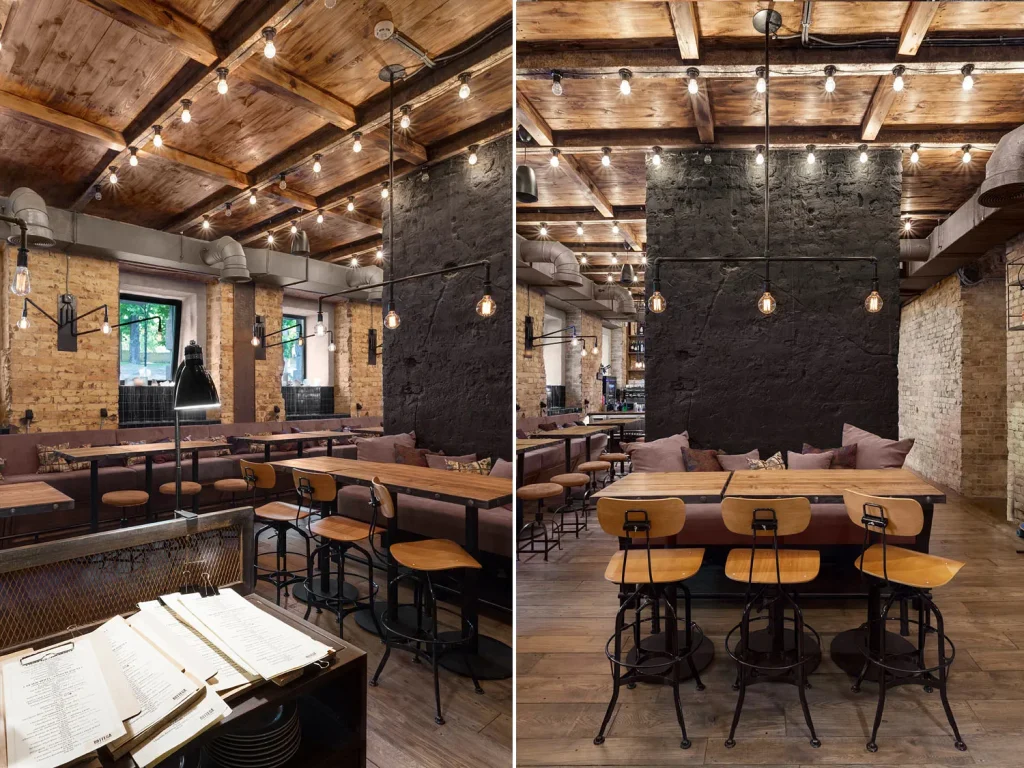 Cafe bar area with hanging Edison bulb lights and a brick backdrop.