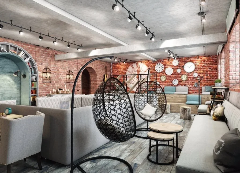 Cozy cafe corner with an exposed brick wall and warm overhead lights.