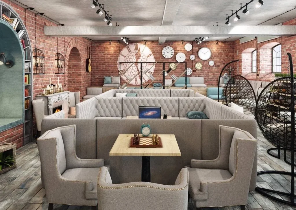 Industrial coffee shop layout with dark walls and soft pendant lighting.